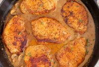 Juicy Dutch Oven Pork Chops with Garlic Herb Sauce