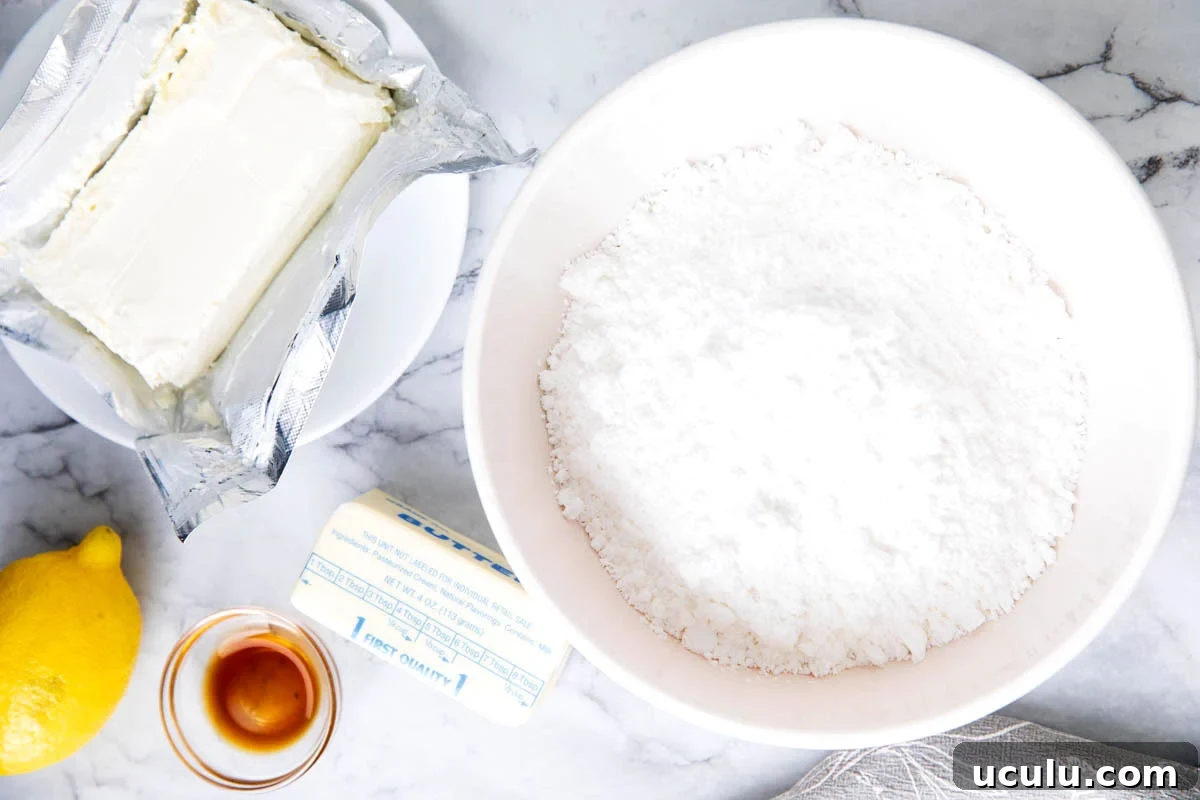 Lemon cream cheese frosting recipe ingredients - cream cheese, butter, confectioners's sugar, lemon juice, lemon zest, and vanilla extract.