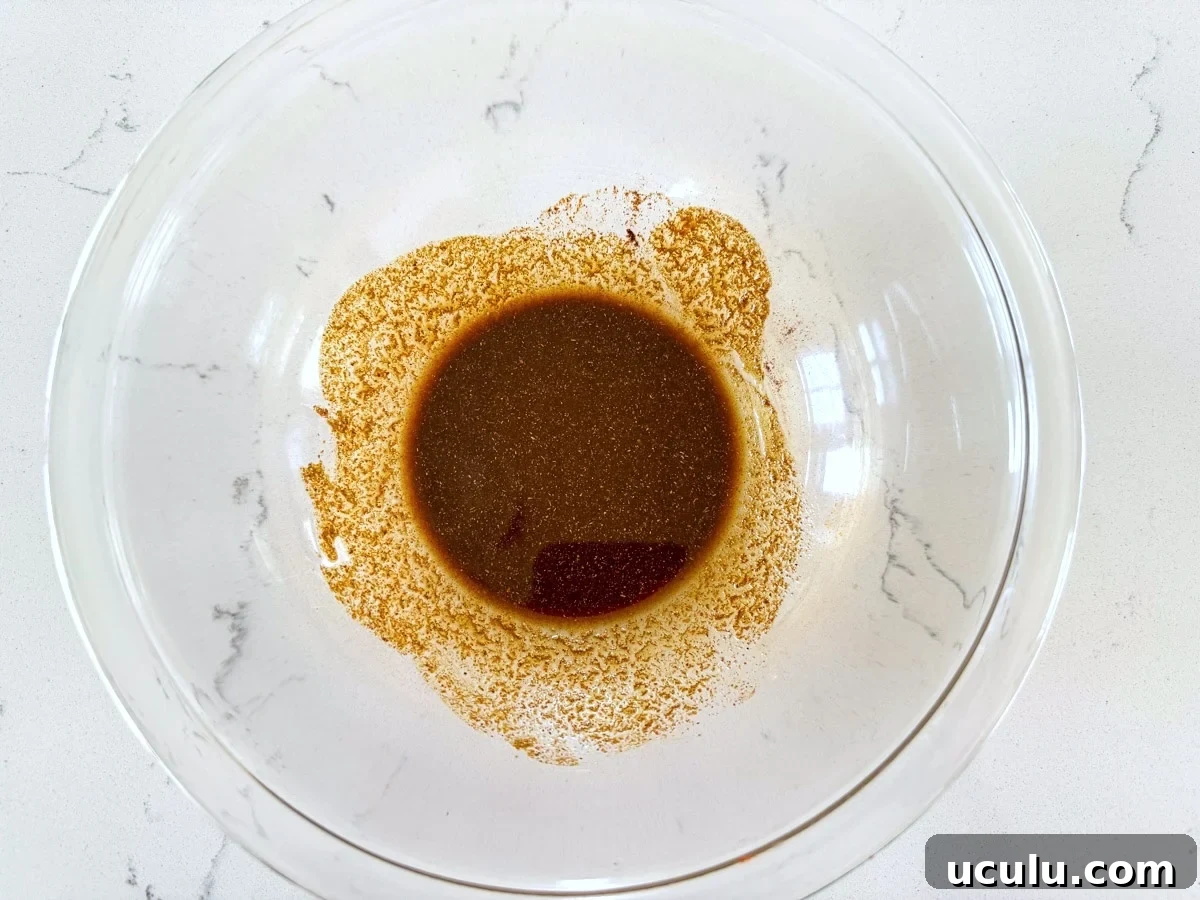oil and spices mixed in a glass bowl