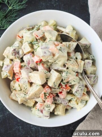 Vegan red roasted potato salad in a serving bowl.