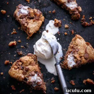 Nutella Stuffed Reese's Peanut Butter Chocolate Chip Skillet Cookie with some ice cream scoop