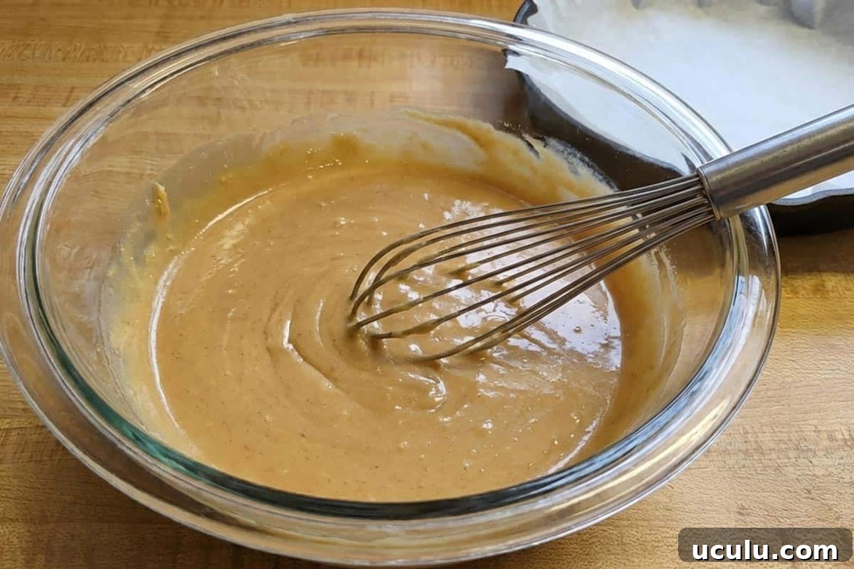 Whisked the melted butter, peanut butter, brown sugar, sugar, vanilla, and egg in a bowl.