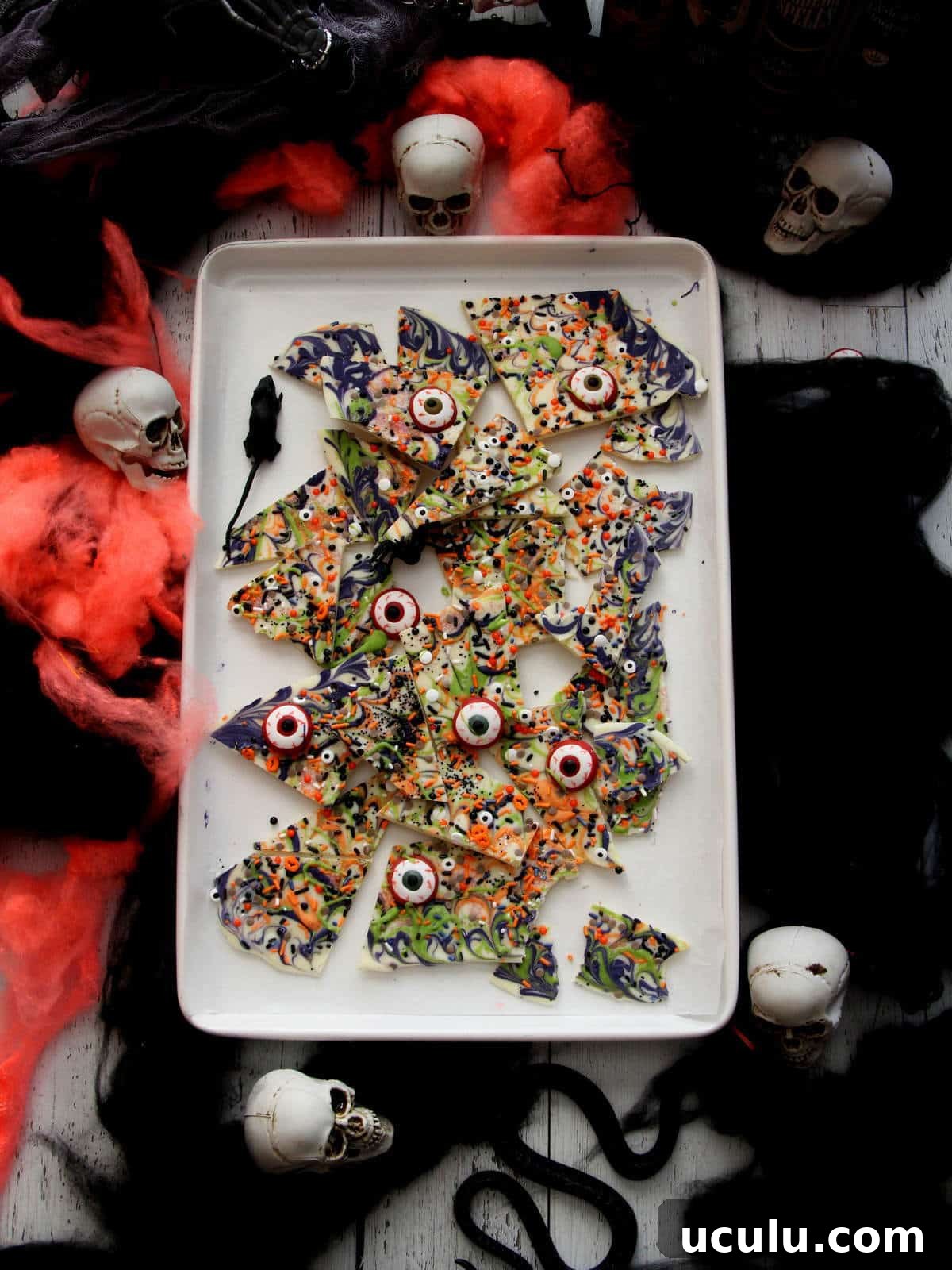 Broken Halloween bark on white baking sheet