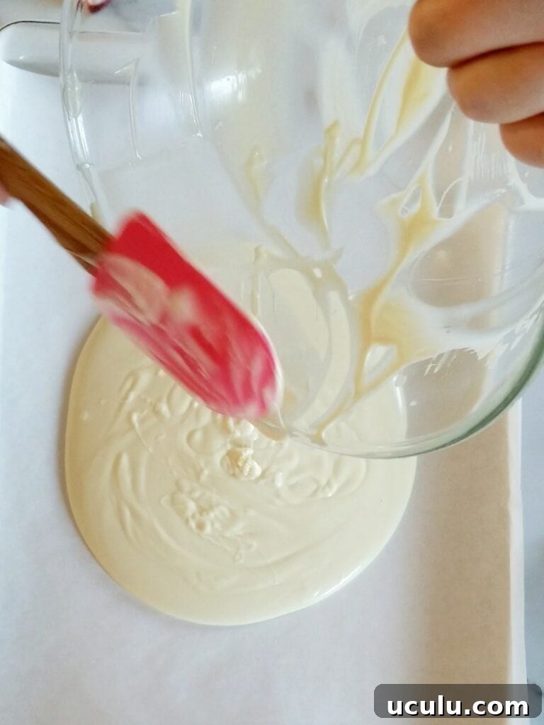 White melted chocolate on baking sheet