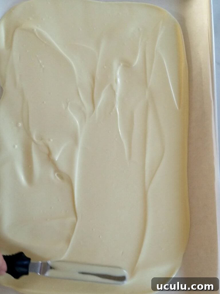 Spreading white melted chocolate
