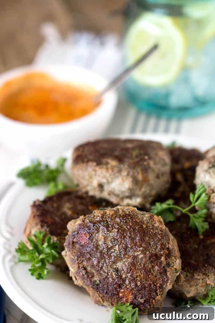 A bunch of rissoles on a plate.