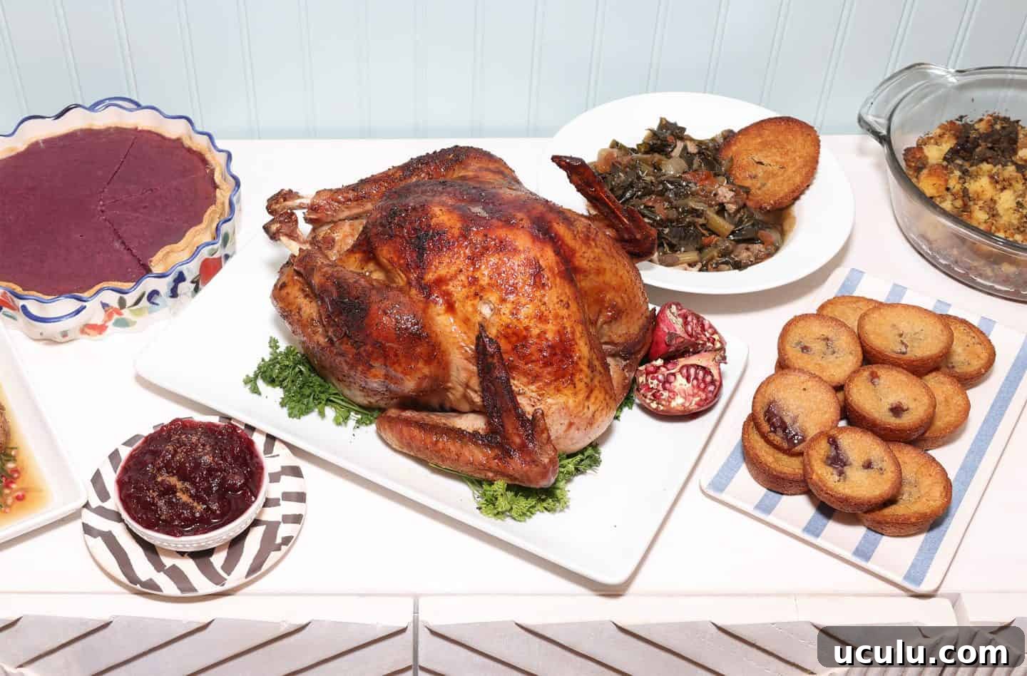 Black folks’ purple sweet potato pie served with Southern turkey, collard greens, and cornbread—classic soul food holiday meal by The Soul Food Pot®