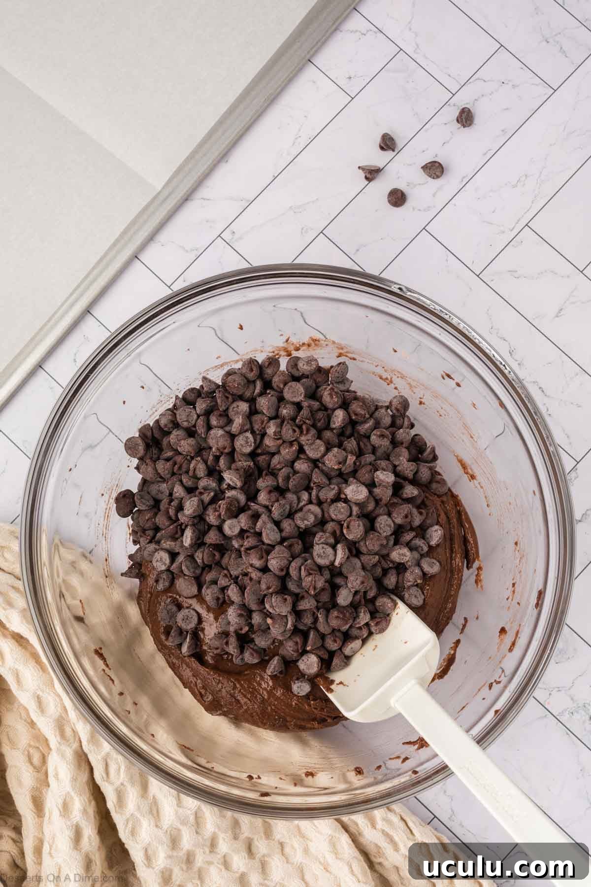 Chocolate chips mixed into batter.