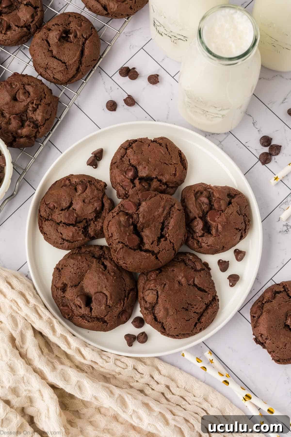 Chocolate cake mix cookies on a white plate. 