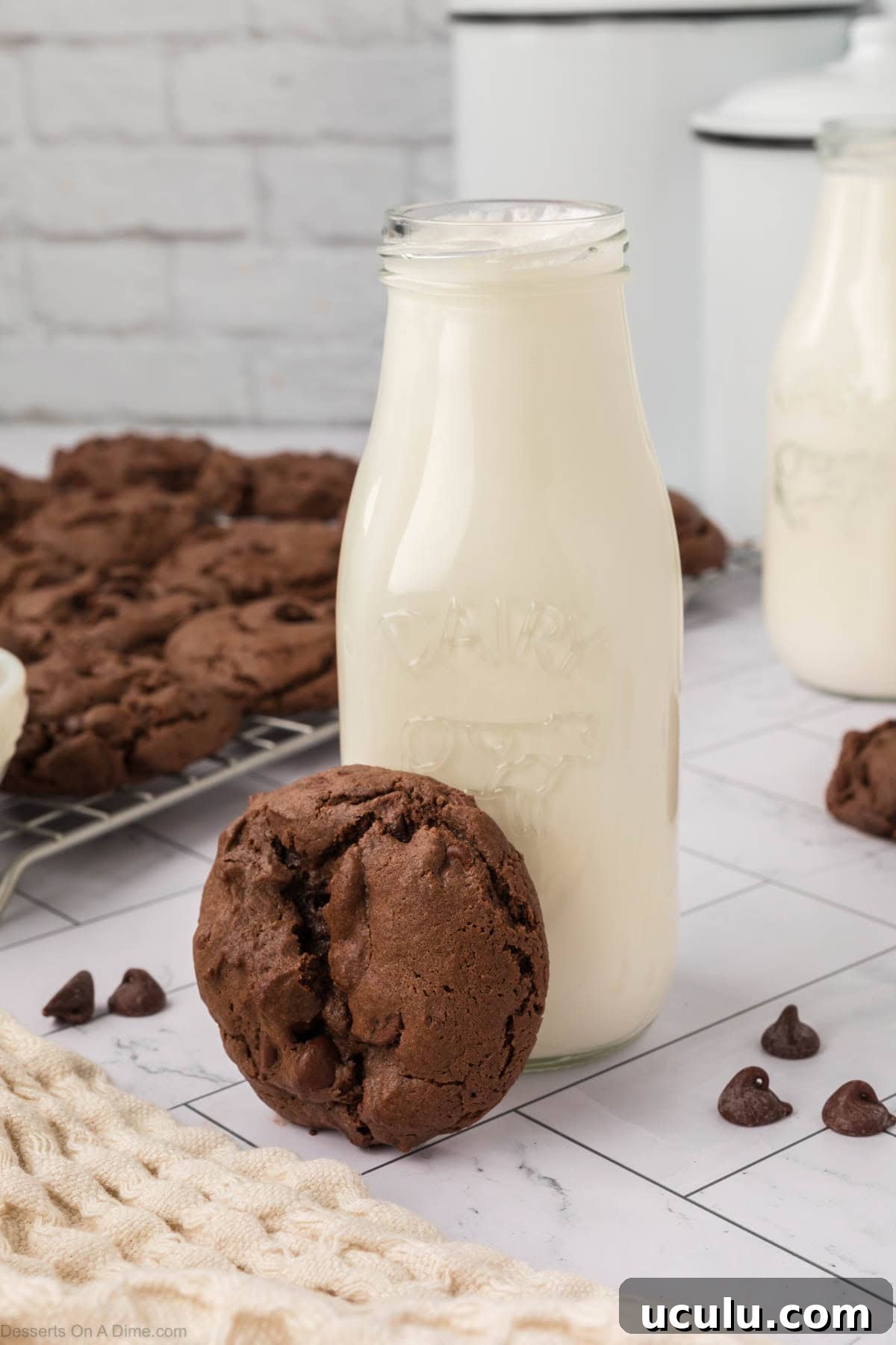 Chocolate Cake Mix Cookies beside a bottle of milk. 