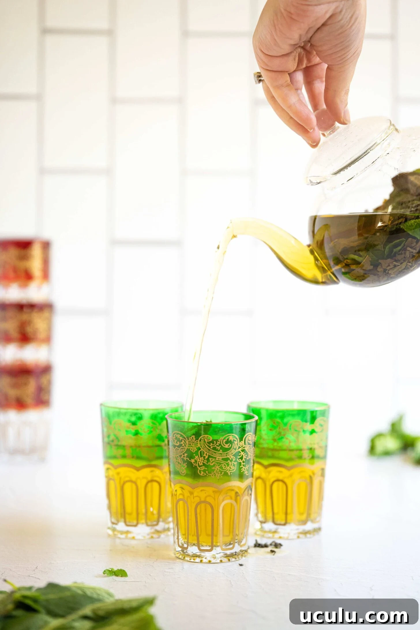 tea pouring into a glass