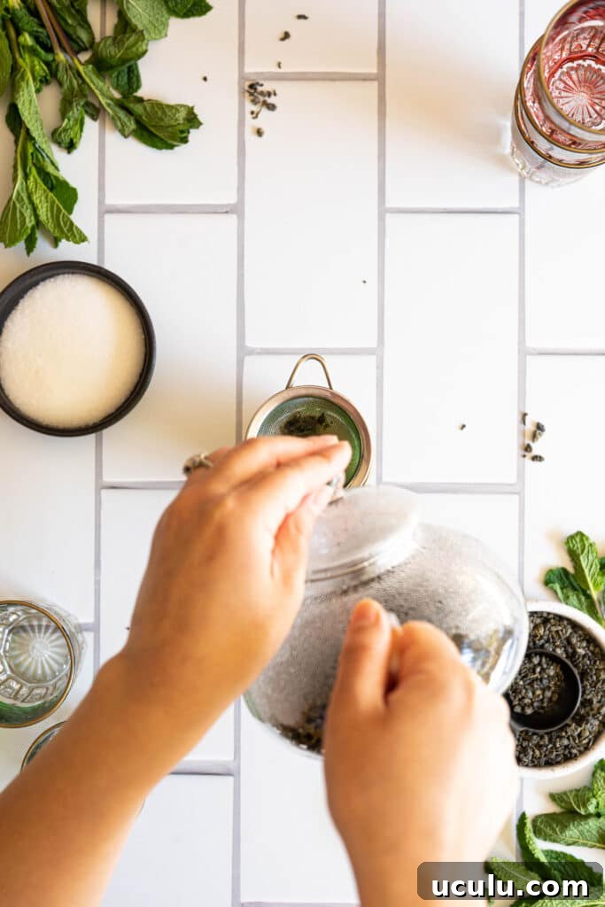 two hands pouring tea