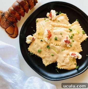 sauce for lobster ravioli served over lobster ravioli next to a lobster tail