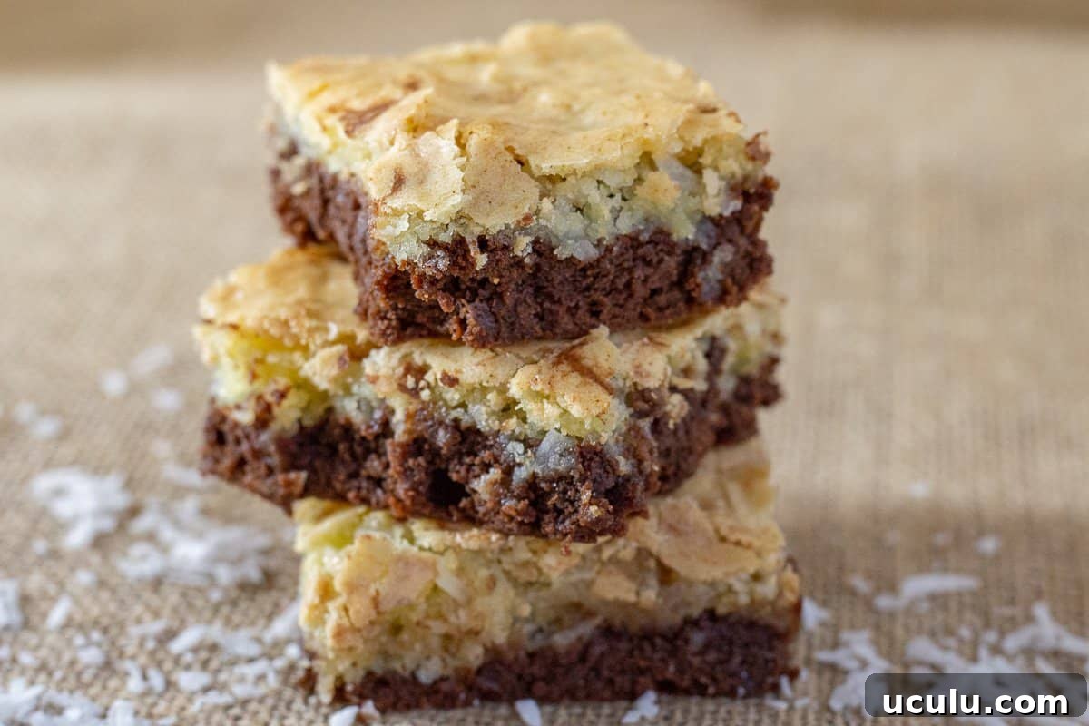 Chocolate Coconut Brownies on piece of burlap cloth surrounded by shredded coconut.