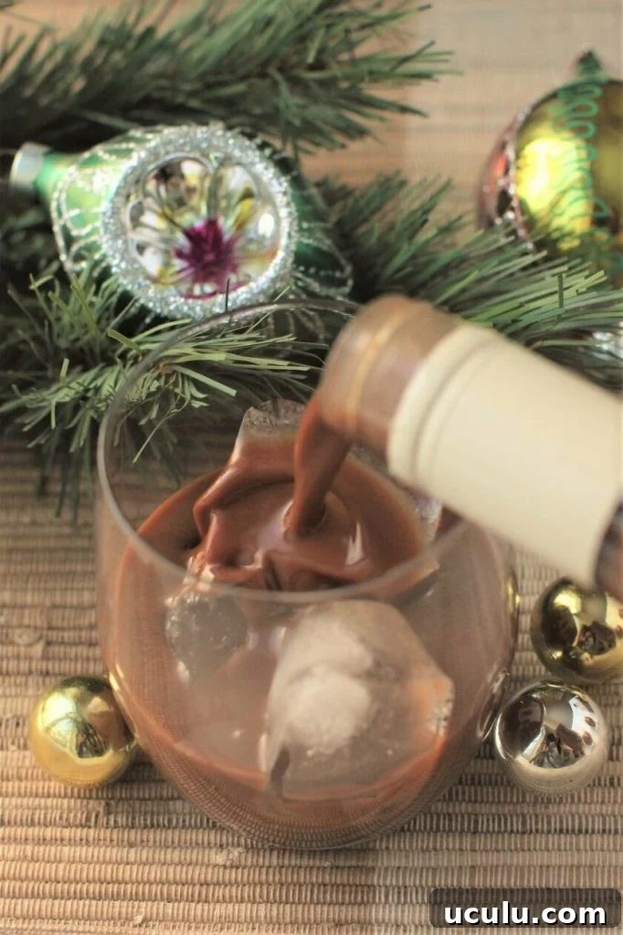 gingerbread cream liqueur; pouring a splash of it over the rocks