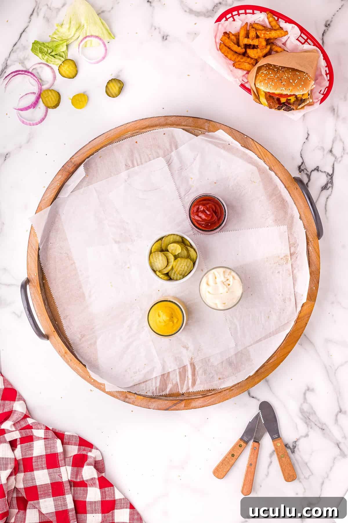 Overhead image of  of condiments for burgers in small bowls