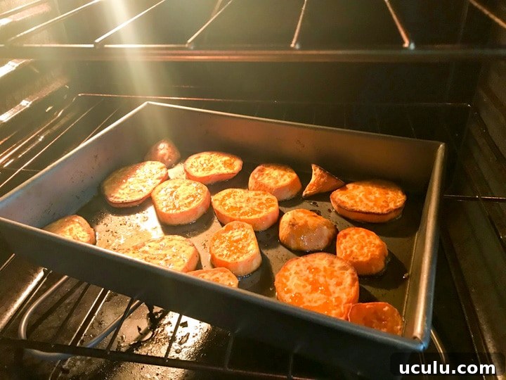 sliced sweet potatoes in an oven