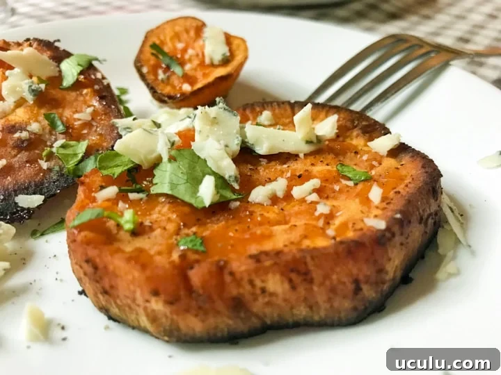 savory roasted sweet potatoes with blue cheese and cilantro on a plate