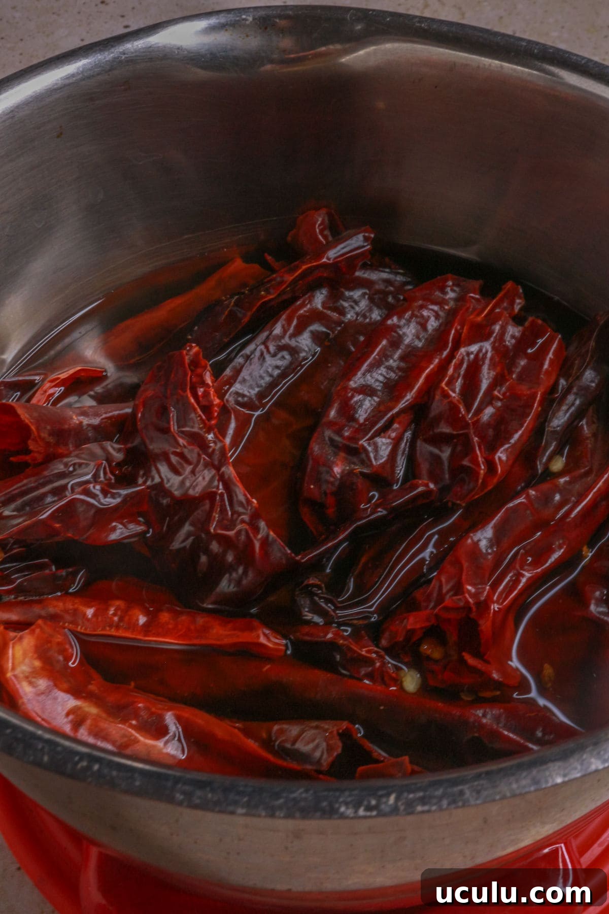 Boiling dried guajillo and arbors chiles to soften