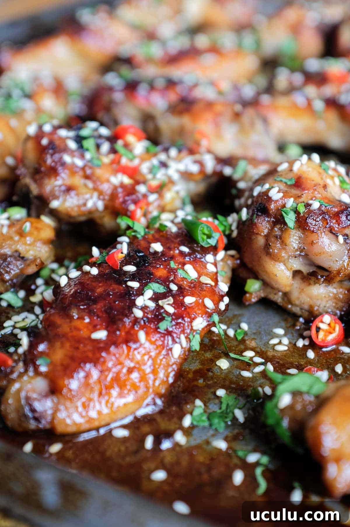 A baking sheet with Sticky Baked Chinese Chicken Wings