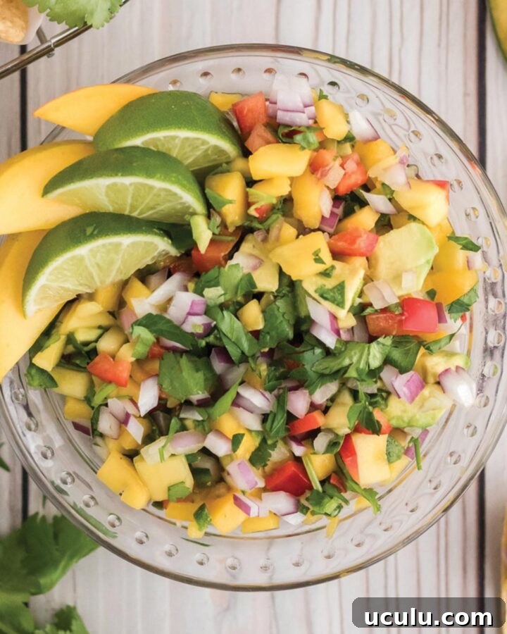 A bowl of fresh pico de gallo with mango