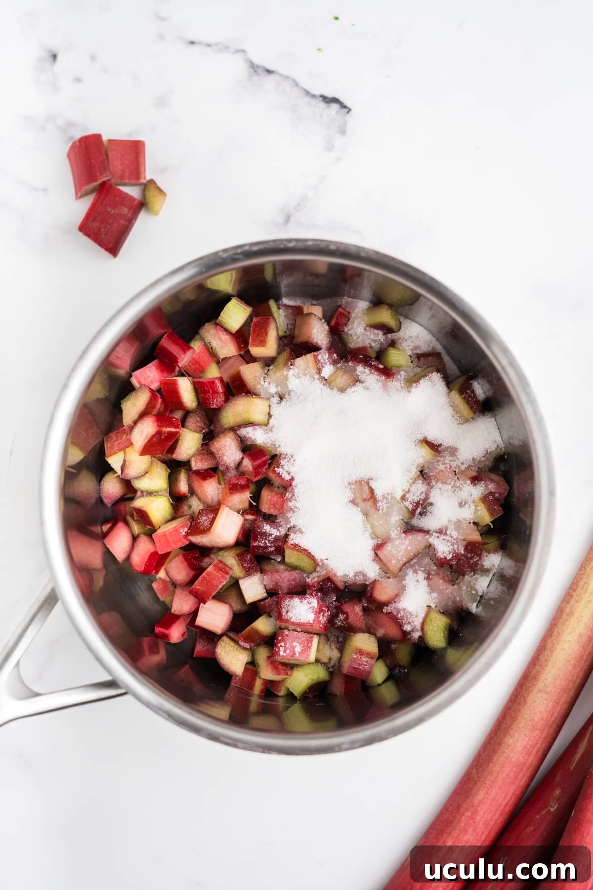 Rhubarb and sugar in a saucepan.