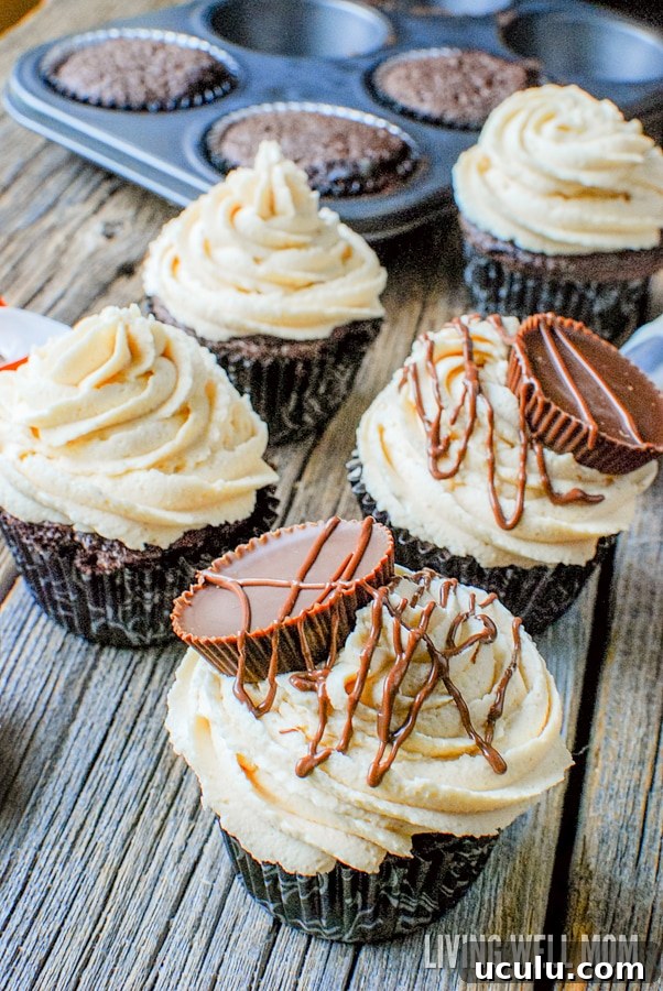 Chocolate Hazelnut Cupcakes with Peanut Butter Cup Frosting - this simple recipe is dessert heaven for chocolate and peanut butter lovers with a peanut butter cream cheese frosting and peanut butter cups drizzled with chocolate!