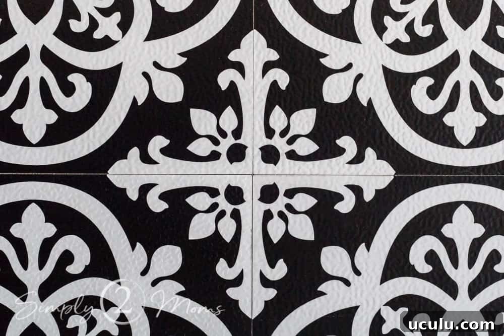 Close up of the intersection of four wallpops vinyl tiles showing the pattern lining up.