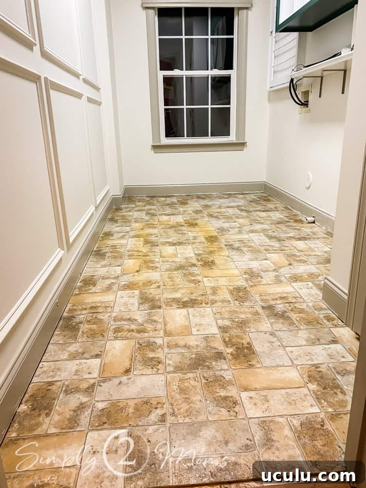 Empty laundry room with vinyl flooring after the vinyl floors have been cleaned.