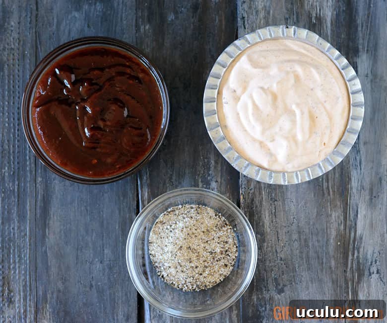 three bowls - one has bbq sauce, one has chipotle crema, one has a rub.