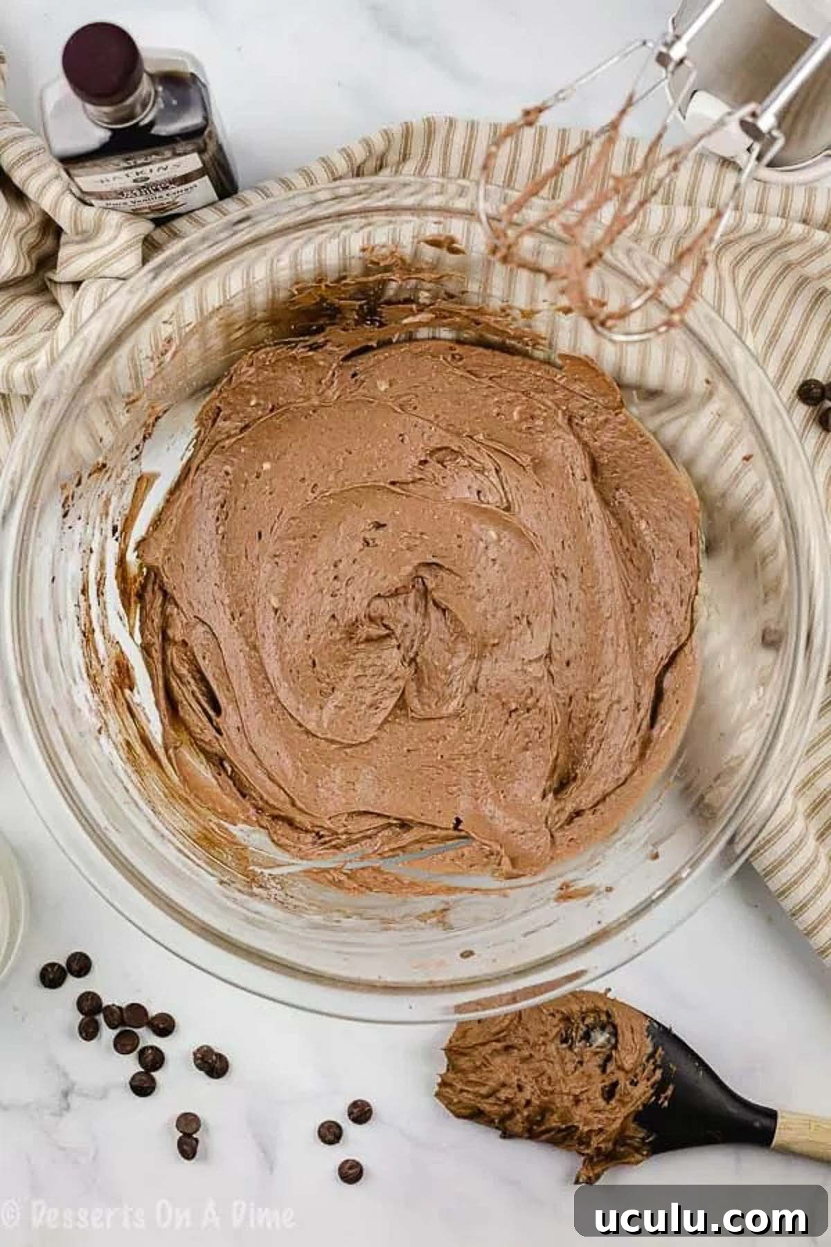 Close up image of a bowl of chocolate frosting.