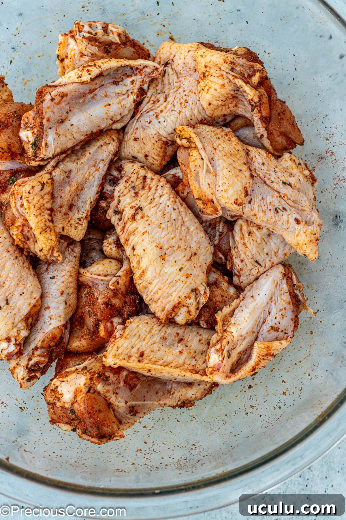 Seasoned chicken in a bowl.