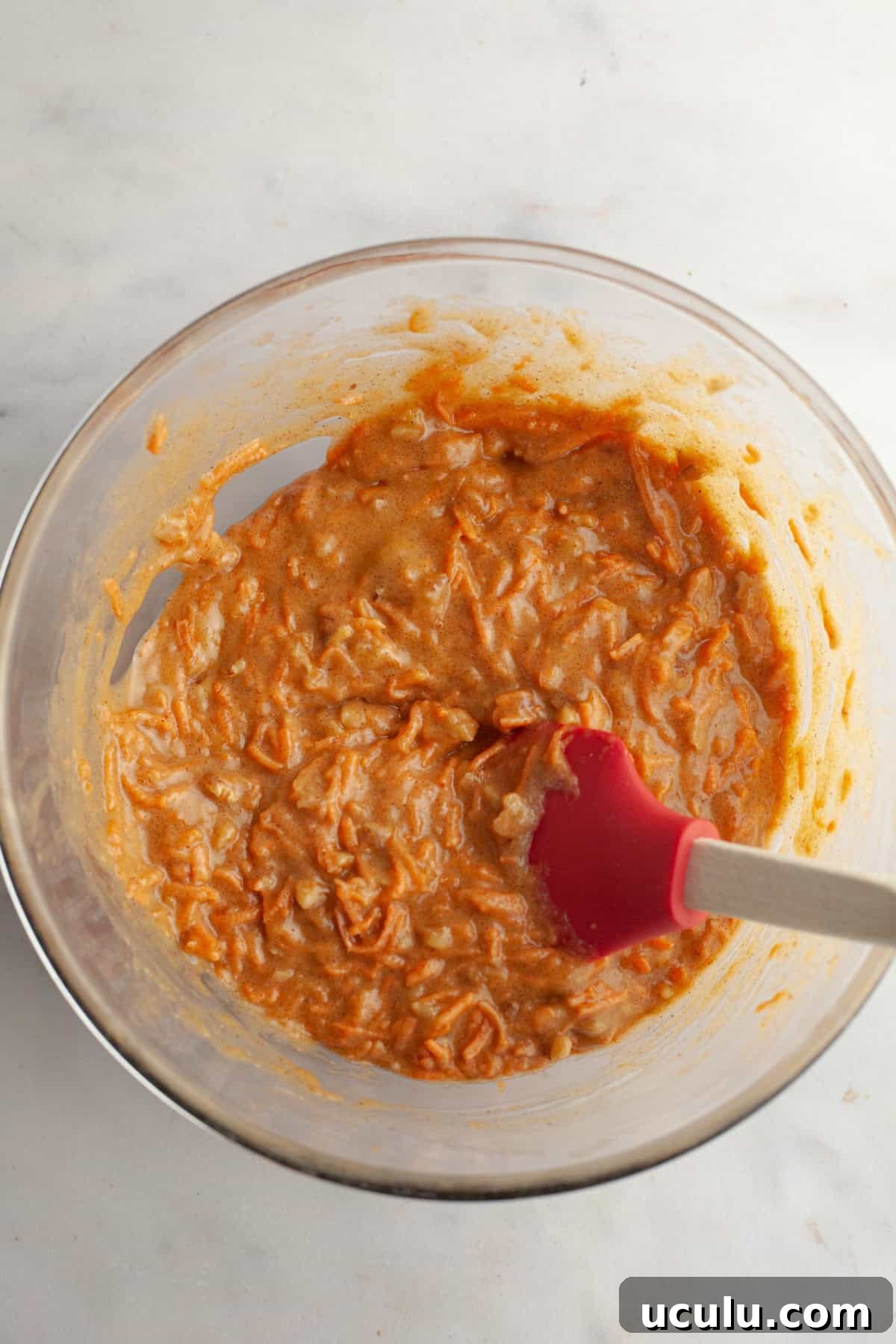 Carrot cake batter in a bowl.