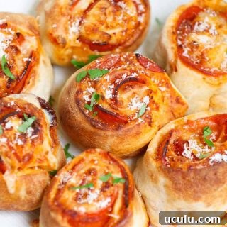 These Air Fryer Pizza Rolls have delicious pepperoni and mozzarella cheese packed in pizza pockets – an instant crowd-pleaser great for appetizer or snack. You can easily make these bite-sized mini pizzas at home from scratch in under 10 minutes. We’ve also included instructions on how to air fry frozen pizza puffs straight from the freezer.