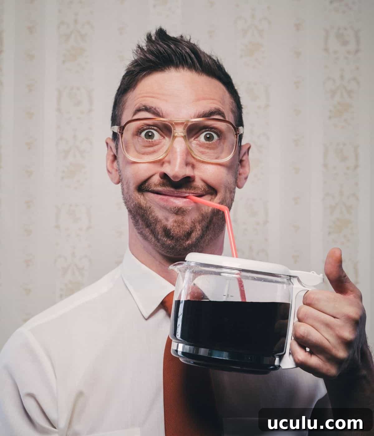 Coffee pot with a straw.