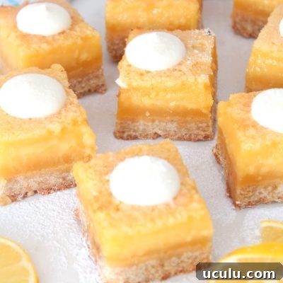 Image of lemon squares with cream cheese icing on top