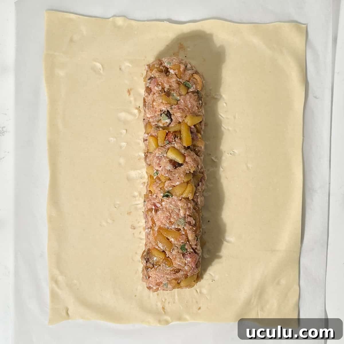 Shaping a sausage meat sausage for the sausage plait.