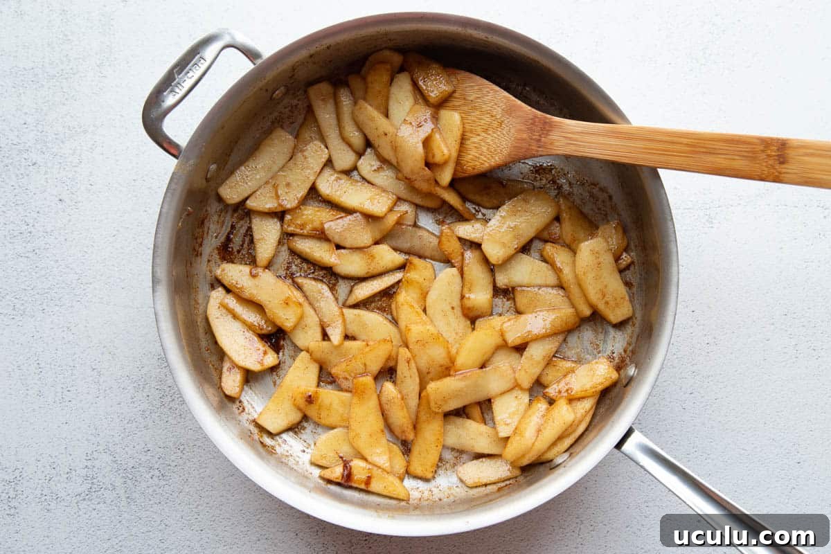 sautéed apples in a skillet.