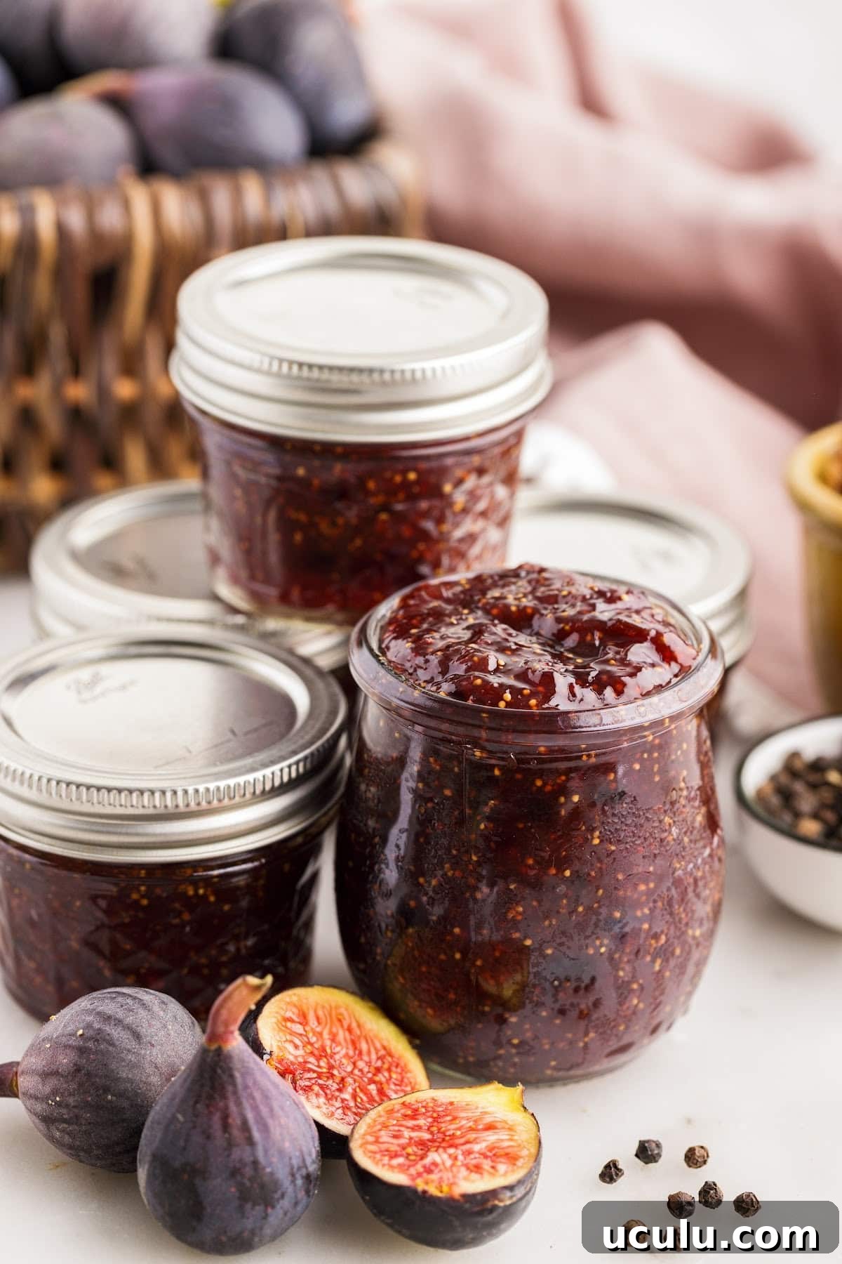 Balsamic fig jam transferred to prepared glass jars, ready to be stored and enjoyed.