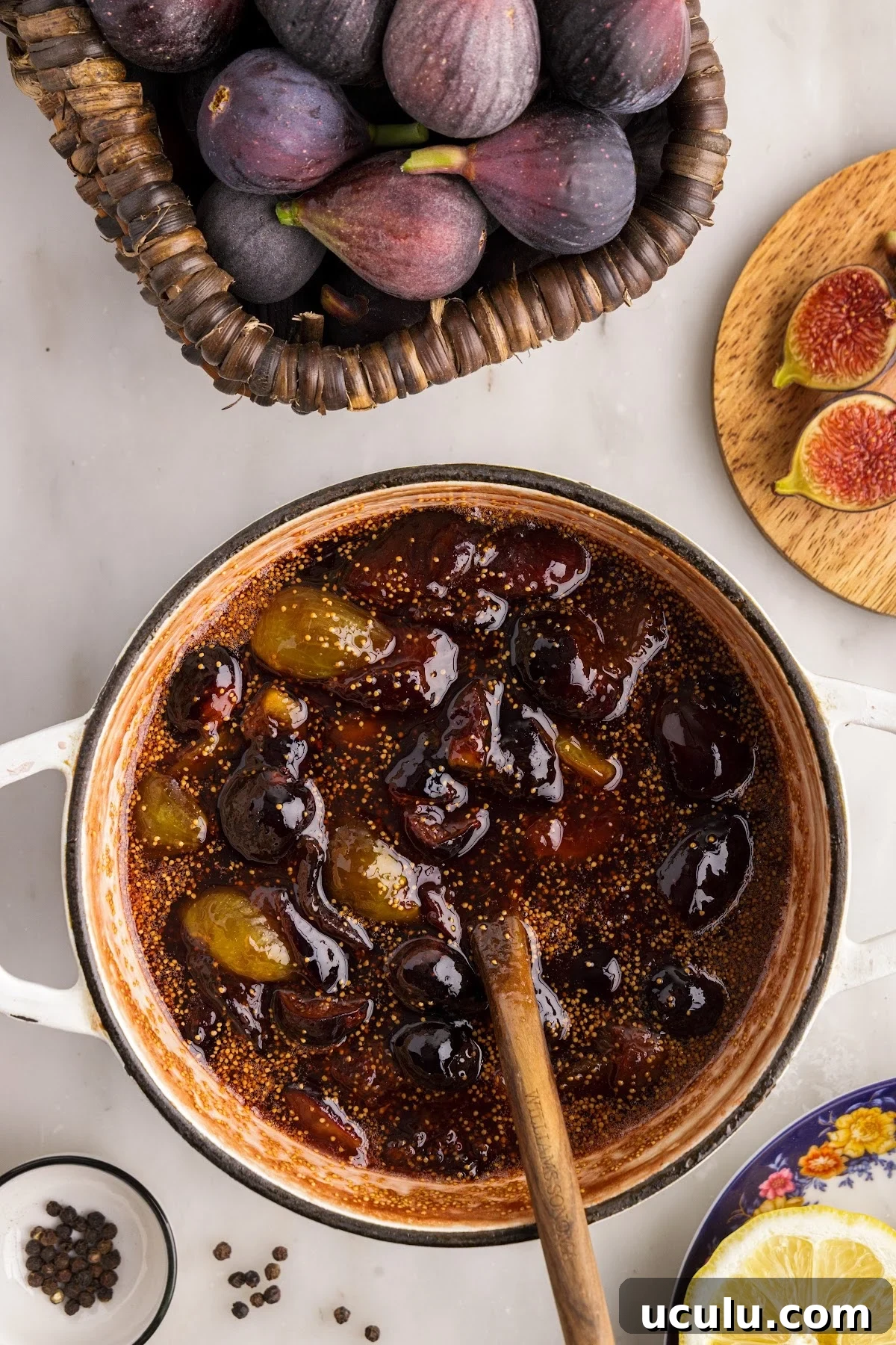 Balsamic fig jam mixture cooking and reducing in a saucepan.