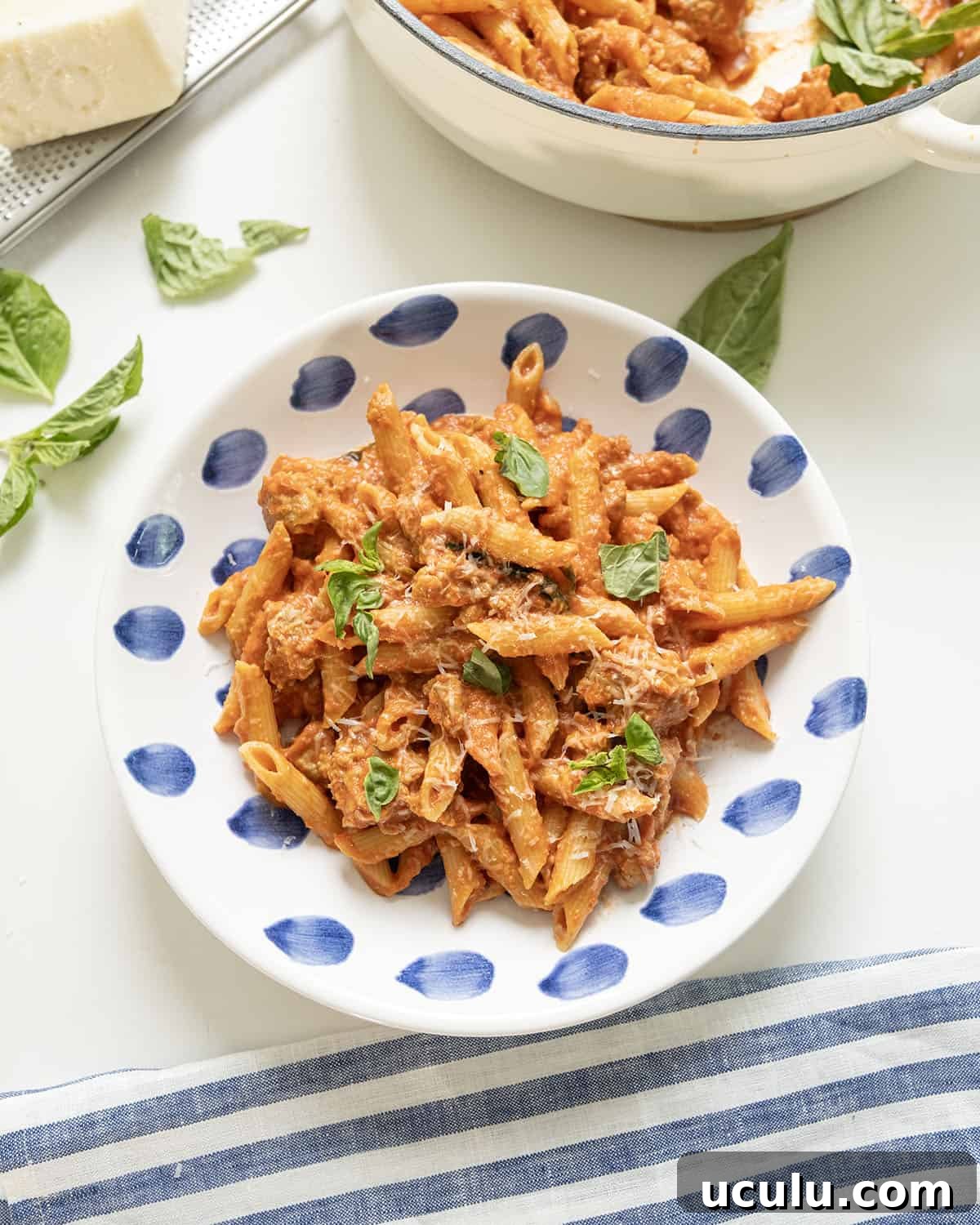 Pink sauce with penne on a plate.