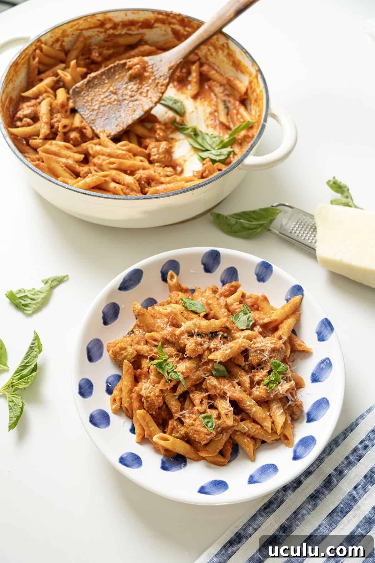 Pink sauce with penne in the pot and in a plate.