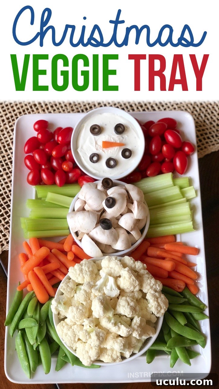 Christmas veggie tray idea for holiday parties! Check out this super fun and cute snowman vegetable tray. It's so simple to make and the kids and adults will love this healthy finger food appetizer idea! Perfect for a crowd or large family gathering. Make ahead, no bake, easy, healthy and super fun!