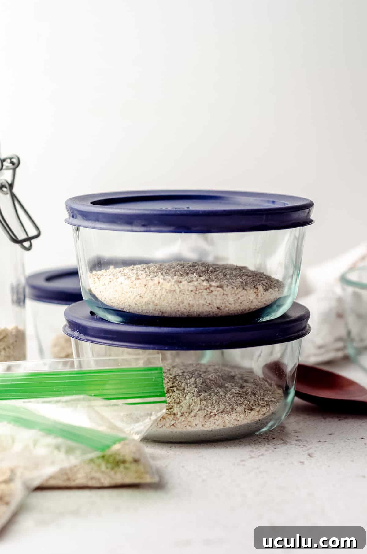 small glass containers and zip top bags with homemade instant oatmeal mix in them