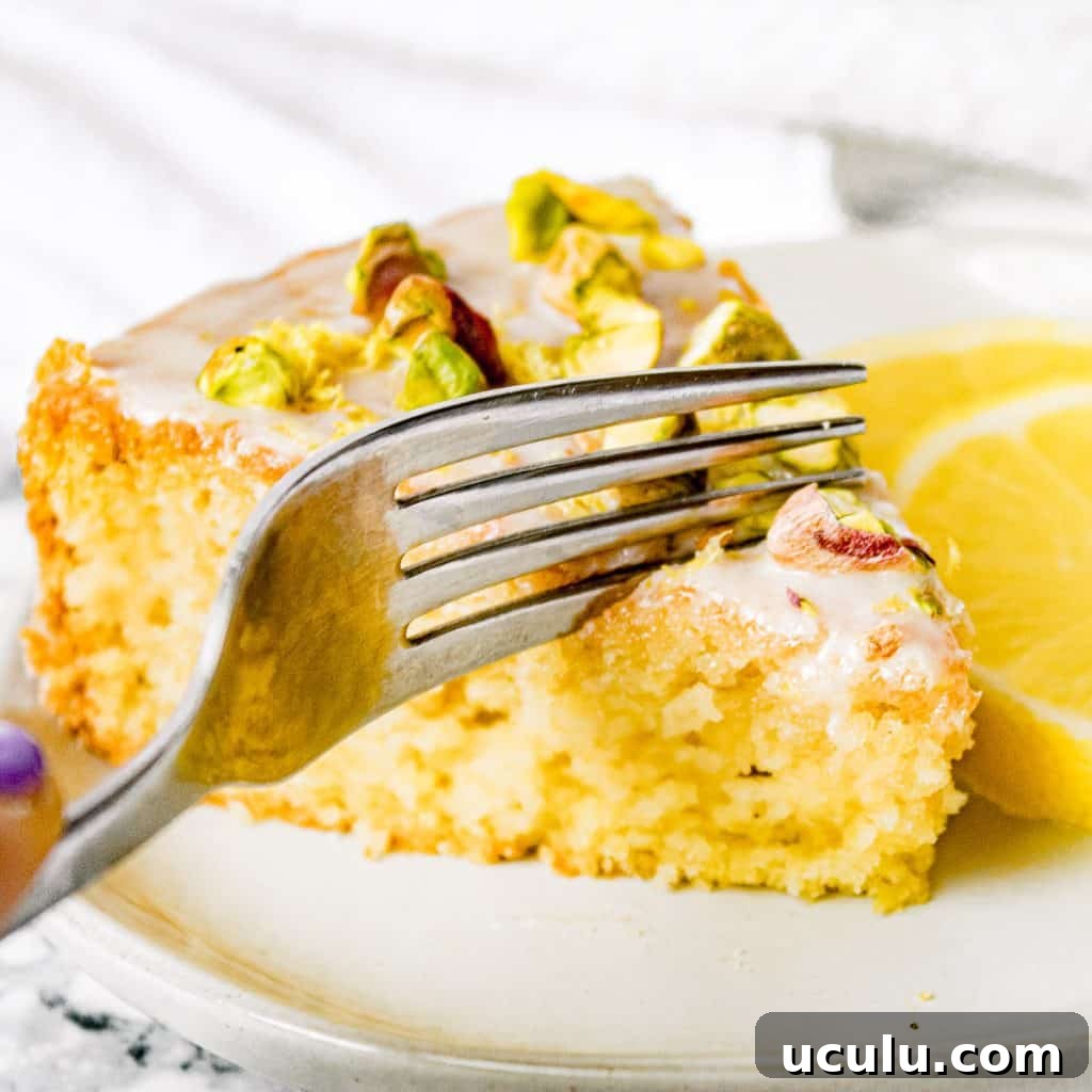 a fork cutting into vegan olive oil cake