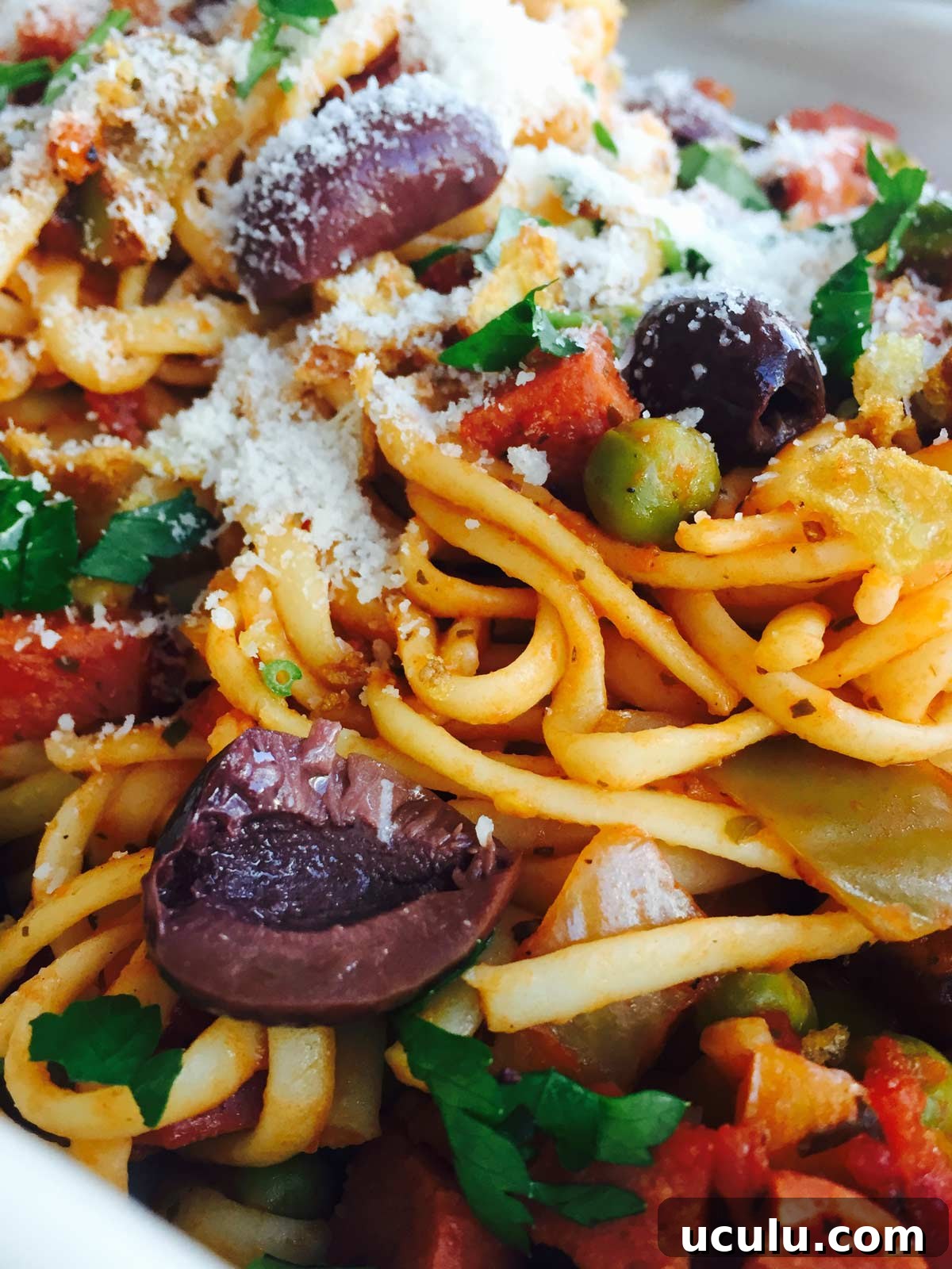 Delicious Chunky Beef Frankfurters, vegetables and kalamata olives linguini