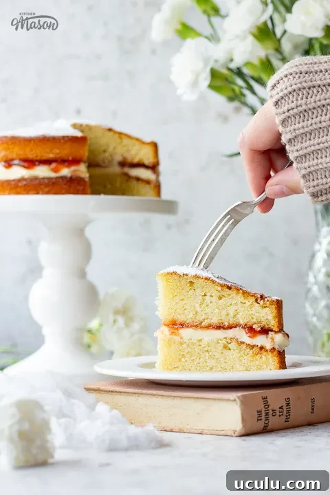 Someone forking a piece of air fryer sponge cake