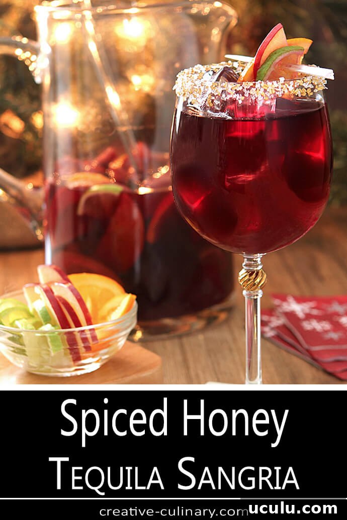 Spiced Honey Tequila Sangria Served in Wine Glasses with Cake Decorating Sugar on Rims