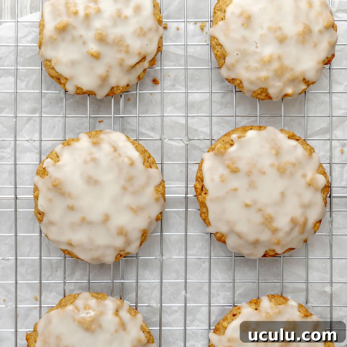 Iced cookies on a cooling rack.