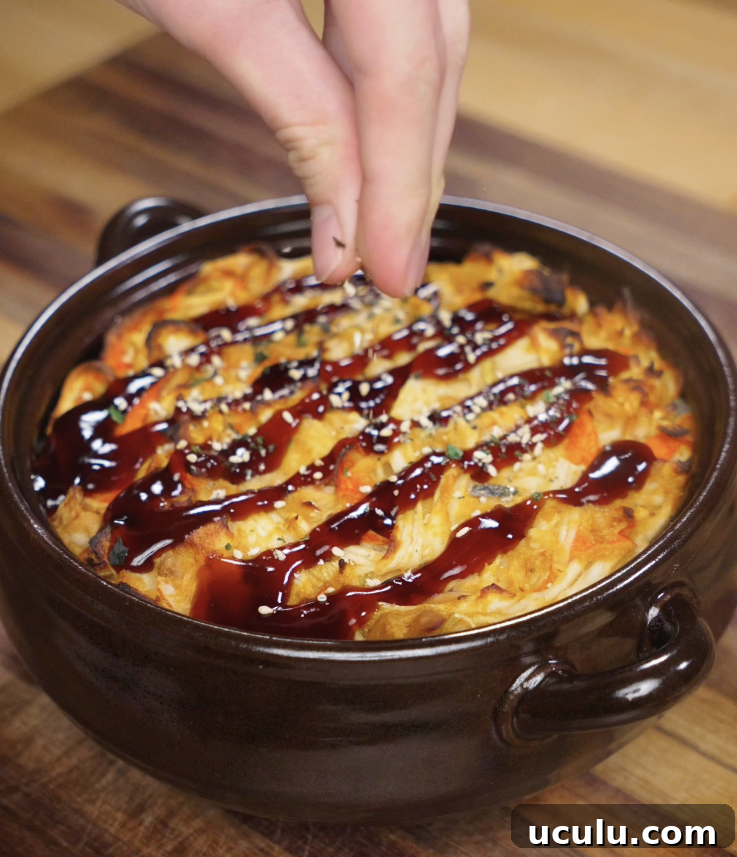 Eel sauce and furikake are sprinkled over the freshly baked sushi casserole while still warm.